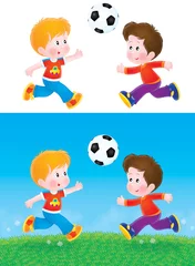 Selbstklebende Fototapeten Jungen spielen Fußball © Alexey Bannykh