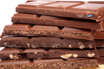 Close up of chocolate pieces on white background