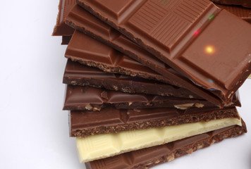 Close up of chocolate pieces on white background