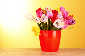 Tulips in vase isolated on white