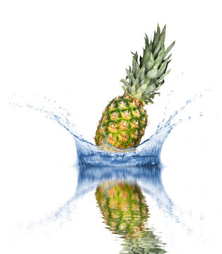 Fresh pineapple dropped into water