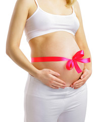 Pregnant woman with pink ribbon on belly isolated on white