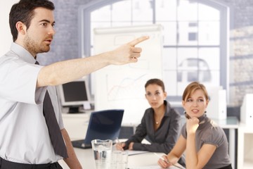 Young office worker leading business training
