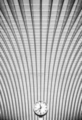 black and white clock in front of modern interior