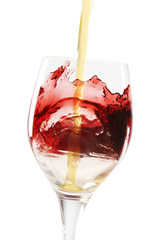 Red wine splashing from a wine glass.