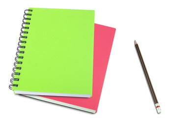 colored notebook and pencils isolated on white background