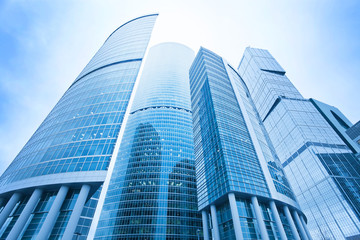 futuristic structure of office skyscrapers in the morning, wide