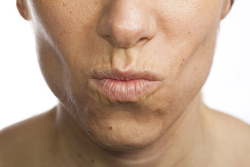 Obraz premium Woman pouting, white background.