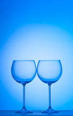 Wine glasses against gradient background