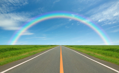 Rainbow over straight road - Powered by Adobe