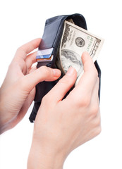 hands taking money from open wallet isolated