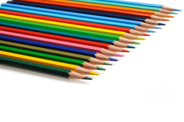 Many colorful school pencils isolated on white background