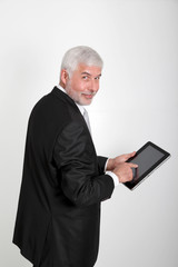 Businessman using electronic tablet