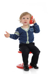 Cute little child speaking on the cell phone. isolated