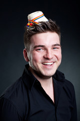 man wearing a romanian hat