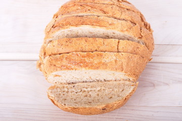 Sliced Loaf of Whole Wheat Bread on Wood Cutting Board