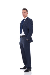 business man standing with hands in pocket