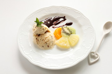 Ice cream with fruit on plate