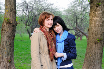 Attractive mother and her daughter in garden