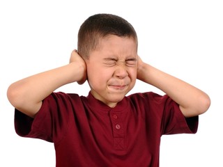 child protecting ears from loud noise