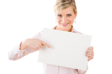 Fototapeta premium Businesswoman pointing front at empty banner