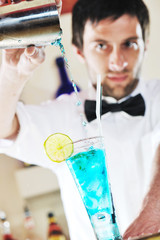 pro barman prepare coctail drink on party
