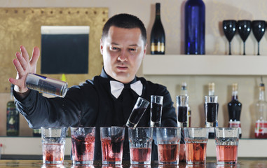 pro barman prepare coctail drink on party
