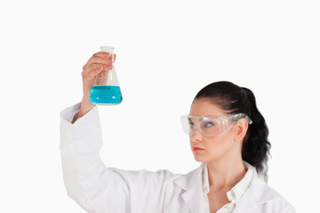 Dark-haired scientist conducting an experiment