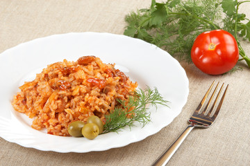 Risotto with meat, mushrooms and tomato sauce