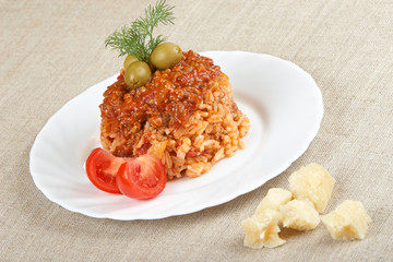 Risotto with meat, mushrooms and tomato sauce