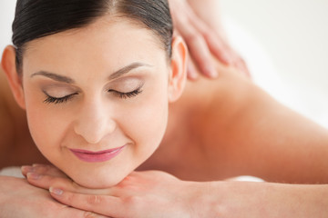 Naklejka premium Pretty brunette enjoying a massage