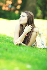 Pretty smiling girl relaxing outdoor