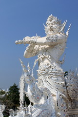 Fototapeta premium Statue of White Temple in Chiang Rai, Thailand