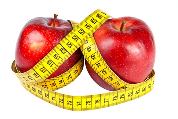 Two apples and measuring tape as weight loss concept