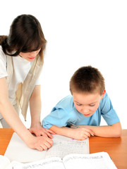 Naklejka premium teenage girl and schoolboy on the table with exercise books