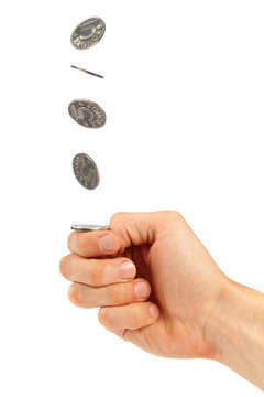 hand flipping a coin
