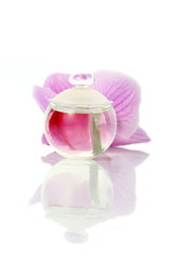 Perfume bottle and orchid flower