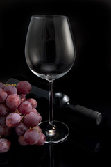 Glass, grapes and bottle of wine