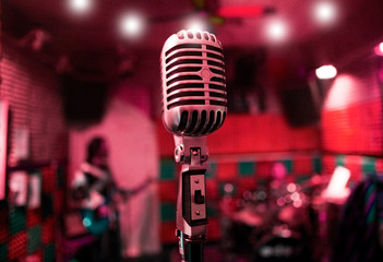 musical background with music band and vintage microphone