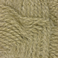 Natural beige fine wool threads texture clew macro closeup