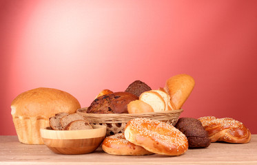 Baked bread assortment on red background