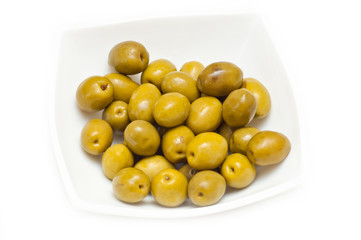 green olives with a branch on a white background