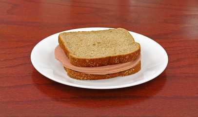 Bologna Sandwich On White Plate © Bert Folsom
