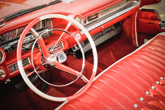 classic car interior with red leather upholstery