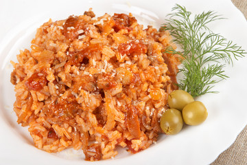 Risotto with meat, mushrooms and tomato sauce