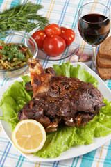 Roast leg of lamb on decorated table