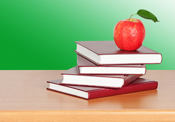 Red apple on  books