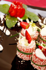 Tiramisu Sushi Roll garnished with Strawberry and Mint