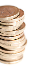 pile of one euro coins isolated on white background