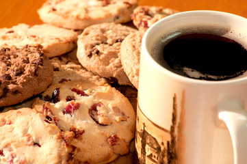 Chocolate and strawberry cookies with a cup of coffee